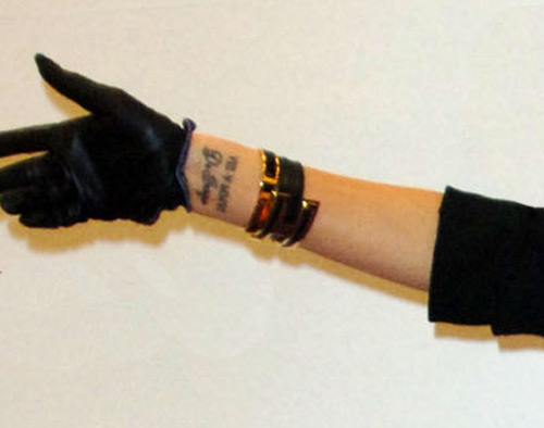victoria beckham tattoo on the left wrist with a type of name tattoo
